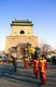 China: A child is paraded on an elaborately decorated palanquin in front of the Bell Tower (Zhonglou), Beijing