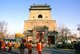 China: A child is paraded on an elaborately decorated palanquin in front of the Bell Tower (Zhonglou), Beijing